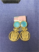 Gold tone lion earrings