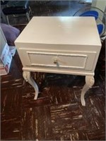 Small white nightstand. Measures 22 inches high