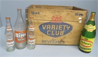 Vintage wood beverage crate with bottles.
