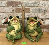 2 smiling frog statues