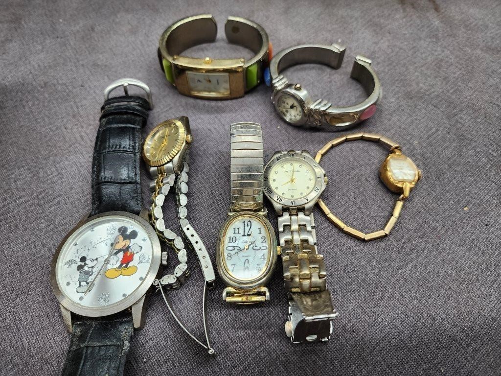 7 watches.  Mickey Mouse,  Timex,  and more.