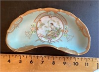 Crescent shaped porcelain bone dish