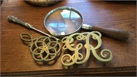 Magnifying glass, letter opener, two brass