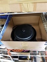 Crate of cast iron cookware