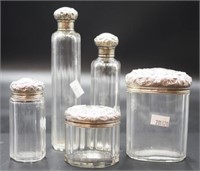 Set of five sterling silver top toiletry bottles