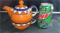 Tea pot and cup