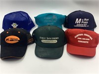 Assortment of hats of local businesses