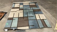 63 x 92 tan/blue area rug
