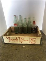 7-Up crate and Coca-Cola bottles