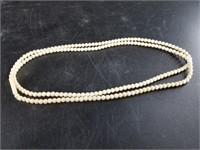 Small ivory beaded necklace with threaded clasp 30
