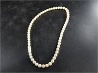 Ivory necklace with threaded clasp
