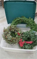 Plastic tub with three large Christmas wreaths