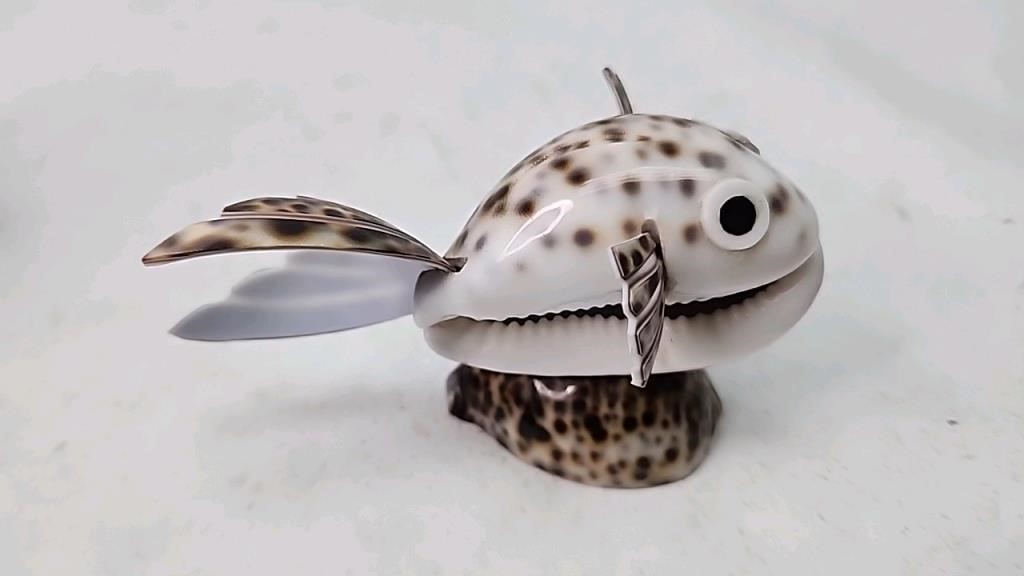 Fish figure made out of shells