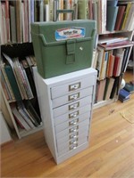 green box & white storage cabinet