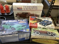 4 model car kits, Duesenberg unopened.