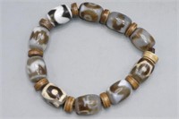 SINO-TIBETAN 'WHEELS OF ETERNITY' PRAYER BRACELET