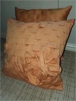 Pair of orange throw pillows