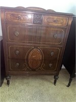 Four drawer antique wooden chest of drawers