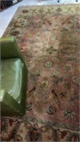 Area rug approximately  131” x  95”  chair not