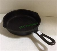 Small single serve Wagner cast iron skillet with a