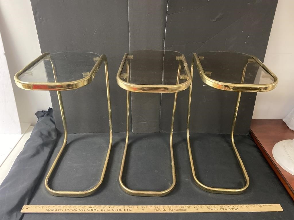 Three glass and metal side tables