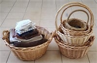 6 Wicker Baskets And Some Towels