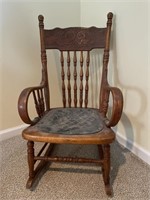 Small wooden rocking chair with leather seat