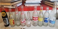 9 vintage soda bottles Coke Grapette Nehi etc