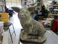 Concrete pig statue.