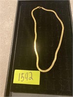gold colored necklace