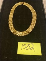 Gold colored choker necklace