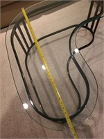 Amoeba shaped glass coffee table. Basement main.