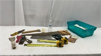 Saws , 2 tape measures , scrapers , hammer holder