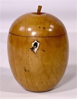 Wooden apple tea caddy, ivory escutcheon, has