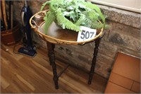 End Table with Basket and Indoor Plant