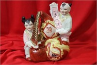 A Chinse Boy and Girl Figurine