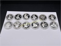 12 SILVER PLATED ZODIAC THEMED BROTHEL TOKENS