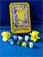 Pokemon figures/erasers  and tin. Different sizes