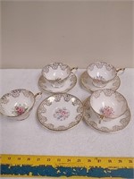 Set of four teacups with saucers