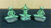 Yoga posing frogs