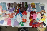 Collection of vintage hand-made Barbie clothes.