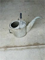 Very old galvanized large watering can. Please