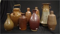 Eight antique & vintage stoneware bottles & vases