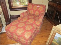 RED UPHOLSTED ARM CHAIR WITH MATCHING OTTOMAN