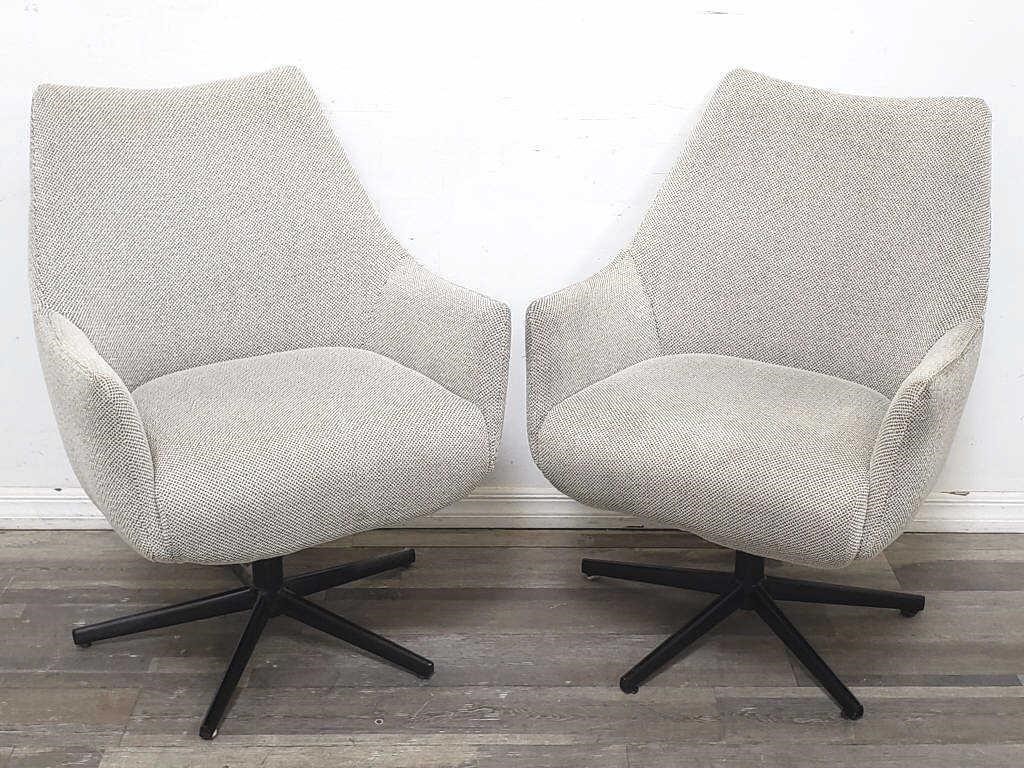 Pair of modern upholstered swivel arm chairs