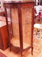 French-style curio cabinet with serpentine glass