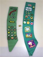 Girl scout sashes with achievement patches and