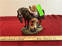 Boy and girl on horse scene