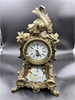 Beautiful brass mantel clock depicting cherubs on