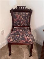 Eastlake style chair with front castors